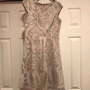 A beige lace dress